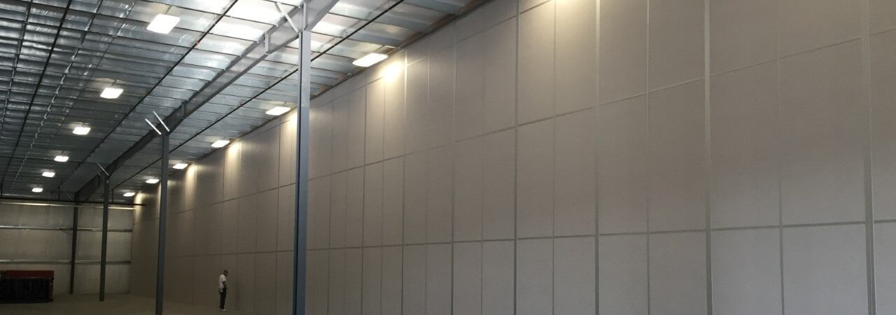 A modular tall wall (demising wall) application within a warehouse.