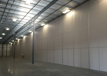 A modular tall wall (demising wall) application within a warehouse.