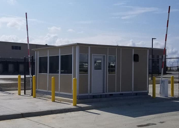 A modular gate house installed at an industrial facility entrance.