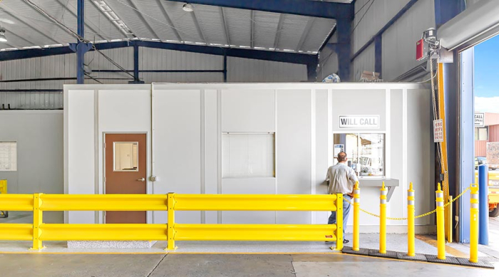 A modular office with a yellow guard rail.