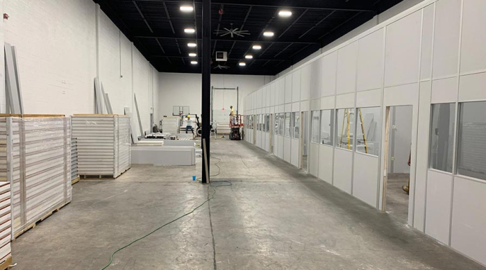 A large space with modular facilities under construction.