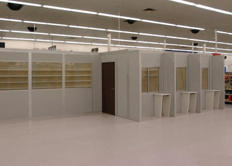Modular retail buildings by Allied Modular inside a store, featuring prefabricated walls, windows, and service counters.