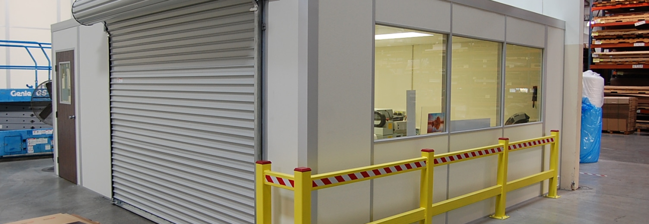 An in-plant modular office with roll-up door.