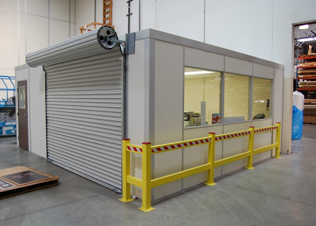 An in-plant modular office with roll-up door.