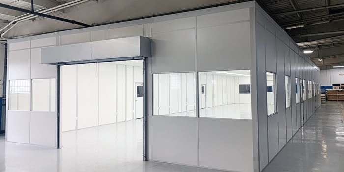 Modular cleanroom with interior windows built by Allied Modular, installed inside a manufacturing facility.