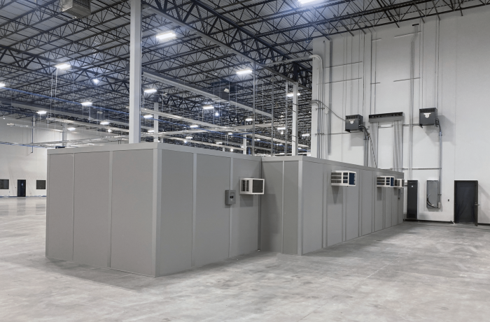 In-plant office facilities within a large warehouse.