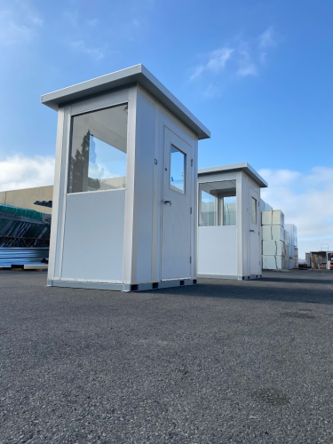 A couple of small guard shacks outside, about to be shipped.
