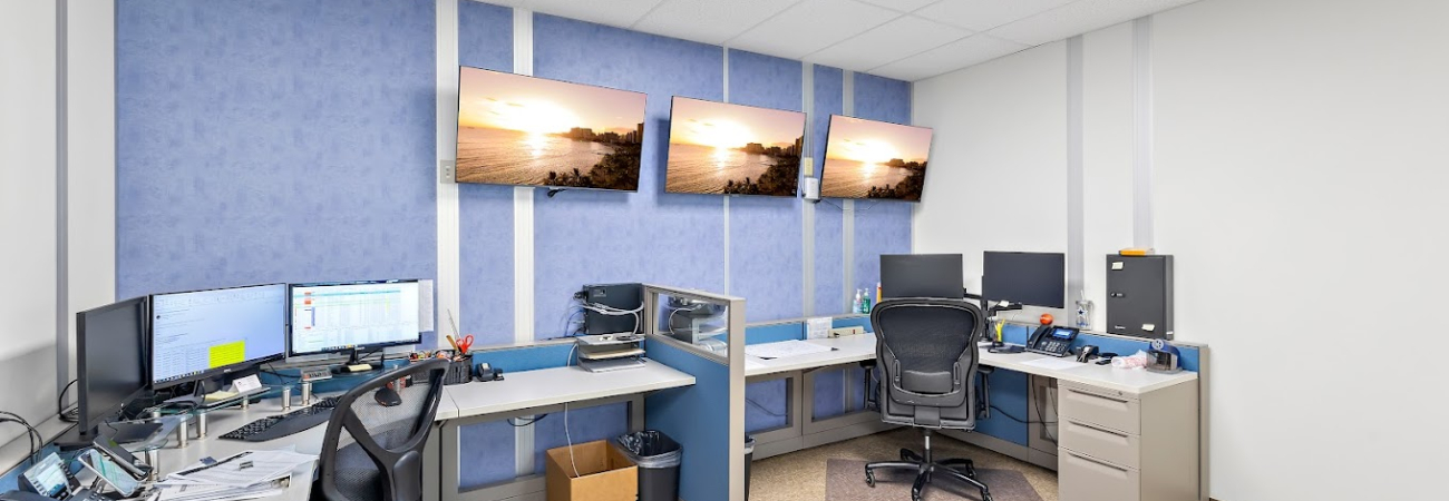 An office with different colored office partitions.