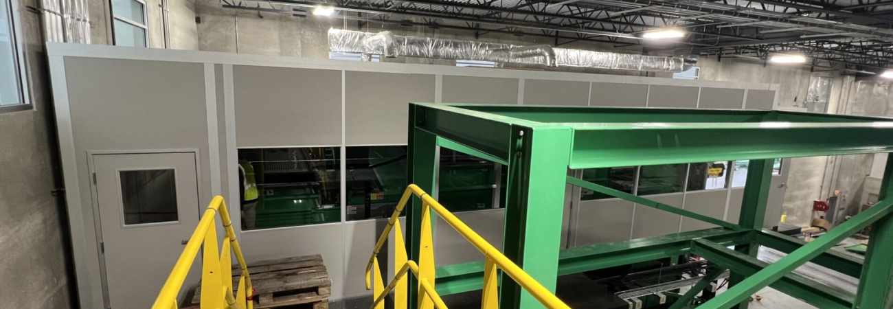 A modular mezzanine (catwalk) structure with safety railings in an industrial setting, designed to manage live loads effectively.