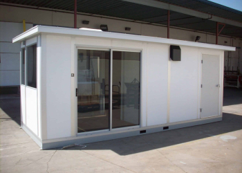 A modular scale house with sliding glass doors and a white exterior, designed to accommodate staff and equipment for managing weighbridge operations at industrial sites.