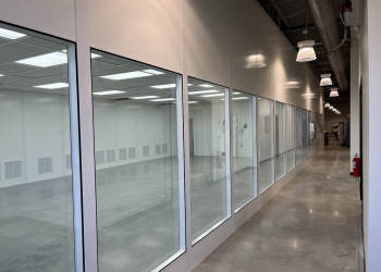 Modular commercial interior with glass panels by Allied Modular.