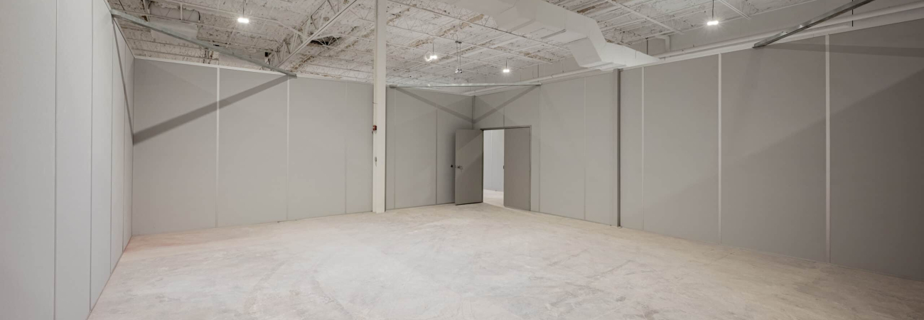 Modular interior space with gray partition walls by Allied Modular.