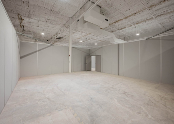 Modular interior space with gray partition walls by Allied Modular.