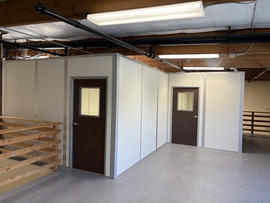Allied Modular enclosed office built with modular partition walls inside an industrial space.