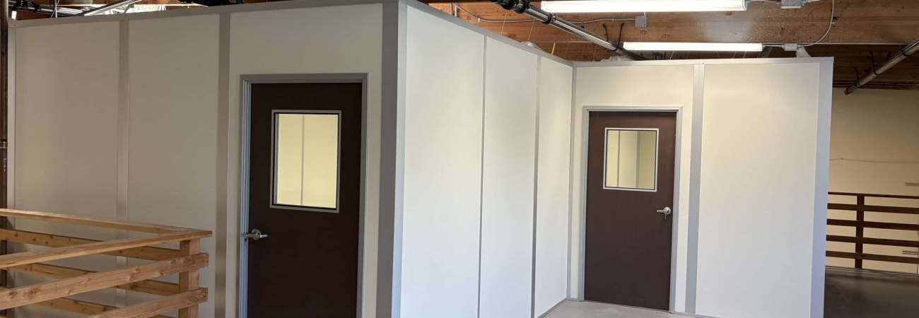 Allied Modular enclosed office built with modular partition walls inside an industrial space.
