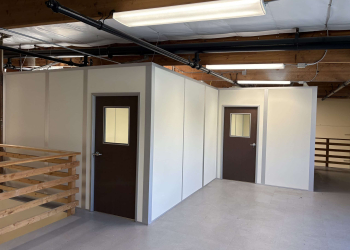 Allied Modular enclosed office built with modular partition walls inside an industrial space.