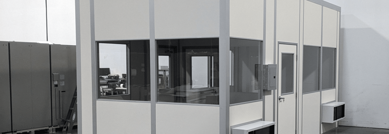 Exterior of an Allied Modular relocatable temporary office building installed inside a warehouse.