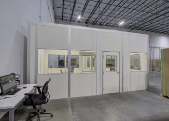 Allied Modular prefabricated inplant office with windows and a door inside a warehouse facility.