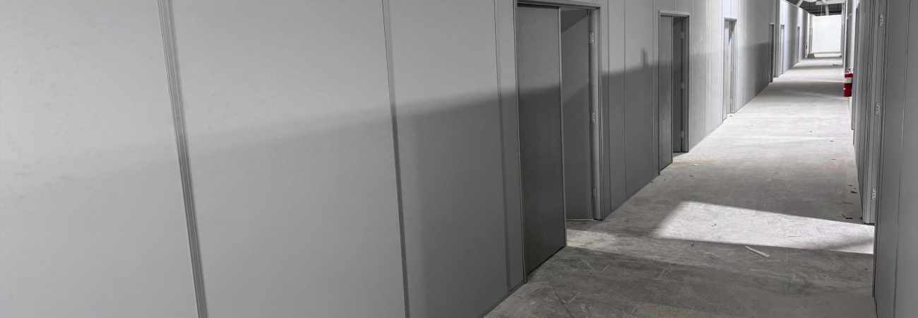 Modular industrial partition walls by Allied Modular inside a warehouse facility