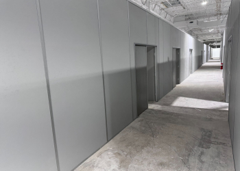 Modular industrial partition walls by Allied Modular inside a warehouse facility