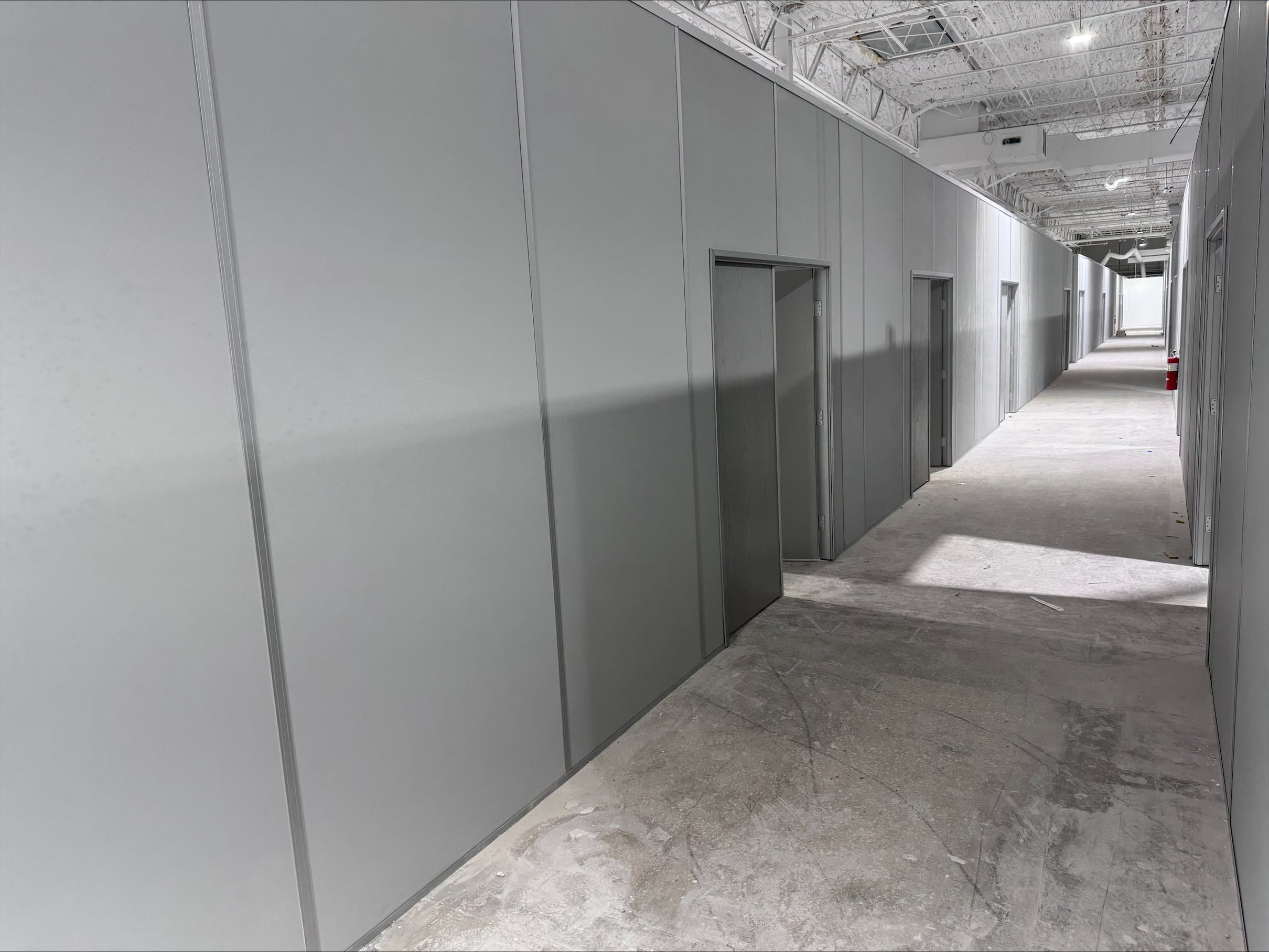 Modular industrial partition walls by Allied Modular inside a warehouse facility