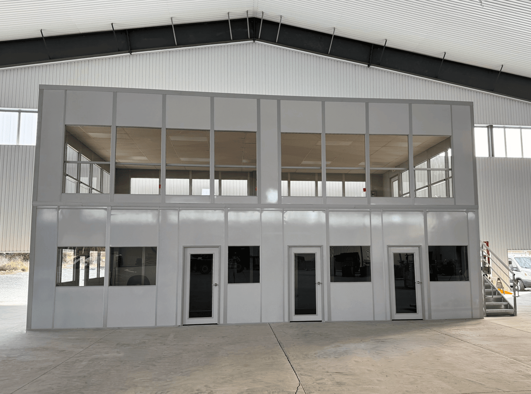 Allied Modular warehouse mezzanine office with upper-level workspace and steel stair access